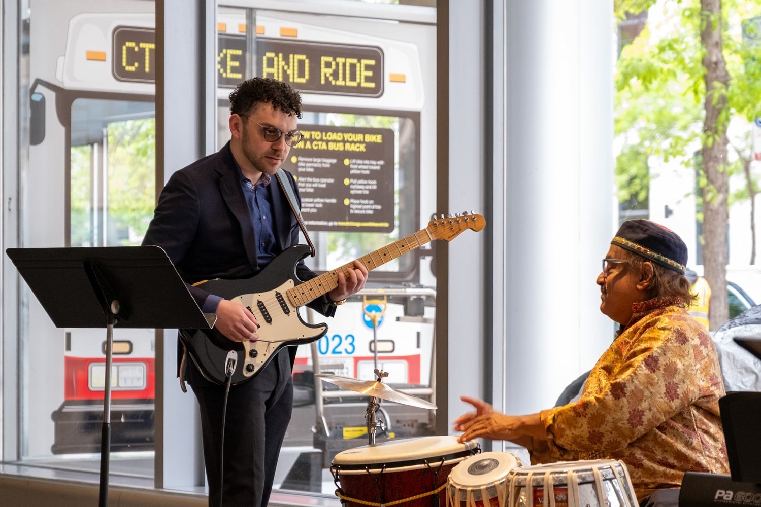 Mandala performing: guitar and drums