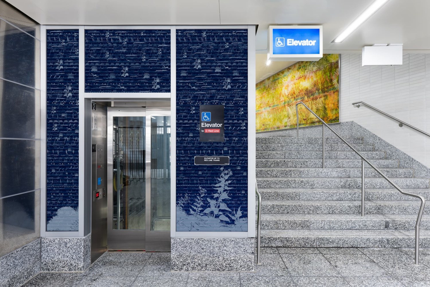 Blue elevator enclosure with graphic renderings of sound frequency.