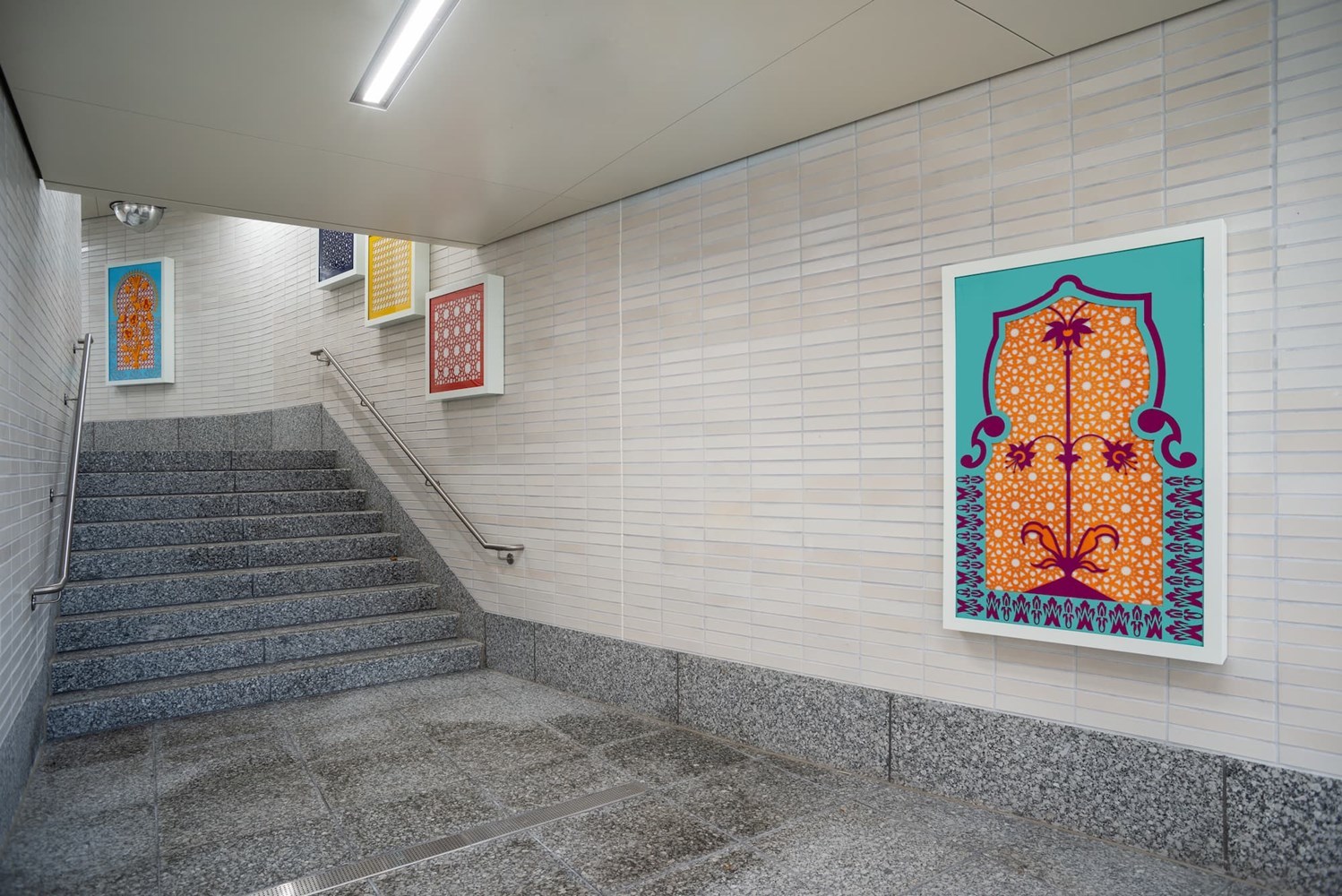 Several mosaics along a staircase.