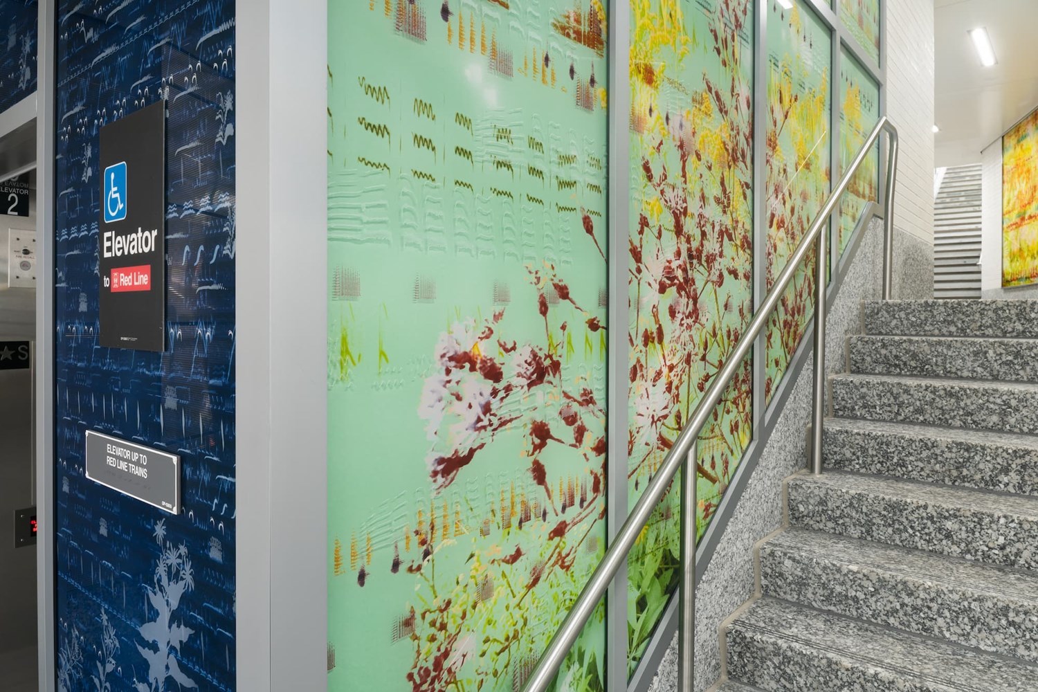 Green elevator enclosure with graphic renderings of sound frequency.