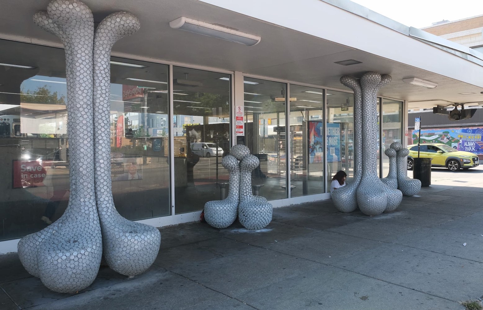 Architectural columns outside a train station, suggesting lotus blossoms.