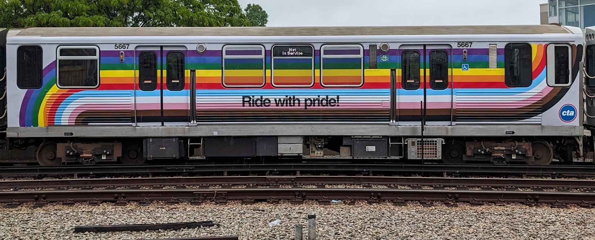 Pride Train car design with swooping color lines