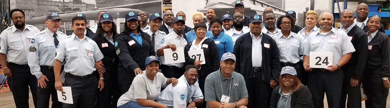 Bus operators in uniform posting for a group picture